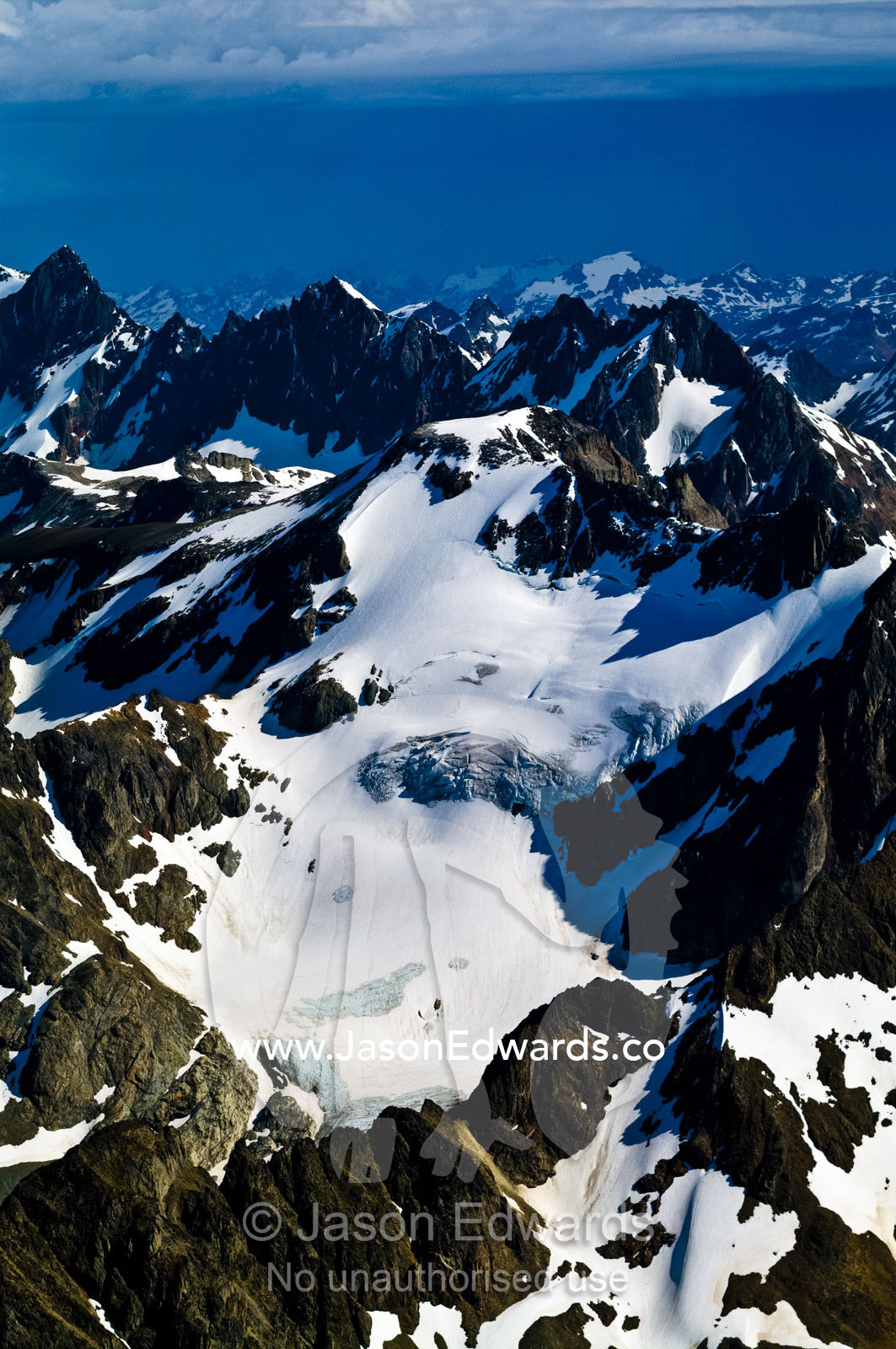 The rugged, inhospitable spine of the Andes covered in snow and ice. Ushuaia, Martial Mountains, Fuegian Andes, Tierra del Fuego Archipelago, Straits of Magellan, Tierra del Fuego Province, Patagonia, Argentina.