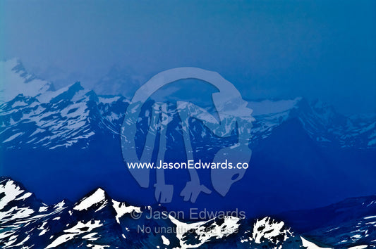 A winter storm engulfs the spine of the Andes covered in snow and ice. Ushuaia, Martial Mountains, Fuegian Andes, Tierra del Fuego Archipelago, Straits of Magellan, Tierra del Fuego Province, Patagonia, Argentina.