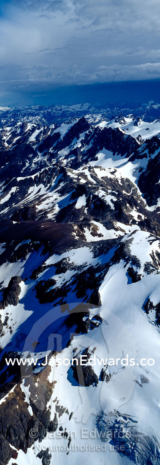 The rugged, inhospitable spine of the Andes covered in snow and ice. Ushuaia, Martial Mountains, Fuegian Andes, Tierra del Fuego Archipelago, Straits of Magellan, Tierra del Fuego Province, Patagonia, Argentina.