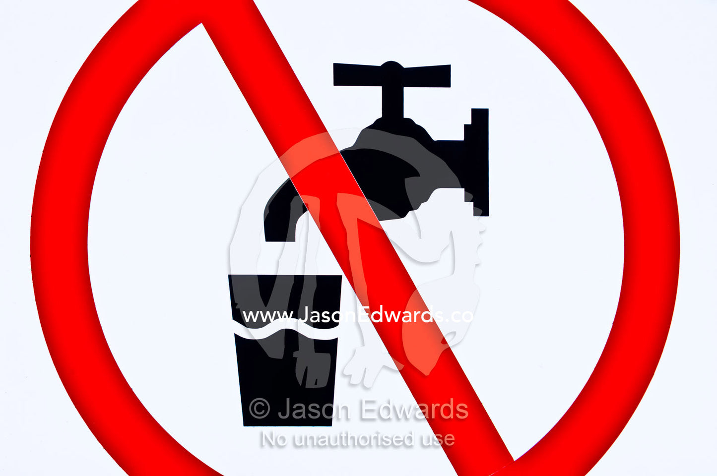 A red warning sign indicates the danger in drinking bore water. Venus Bay, South Gippsland, Victoria, Australia.