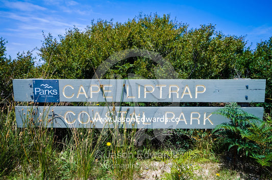 A national park sign surrounded by Coastal Tea Tree scrub. Walkerville, Cape Liptrap Coastal Park, Bass Strait, South Gippsland, Victoria, Australia.