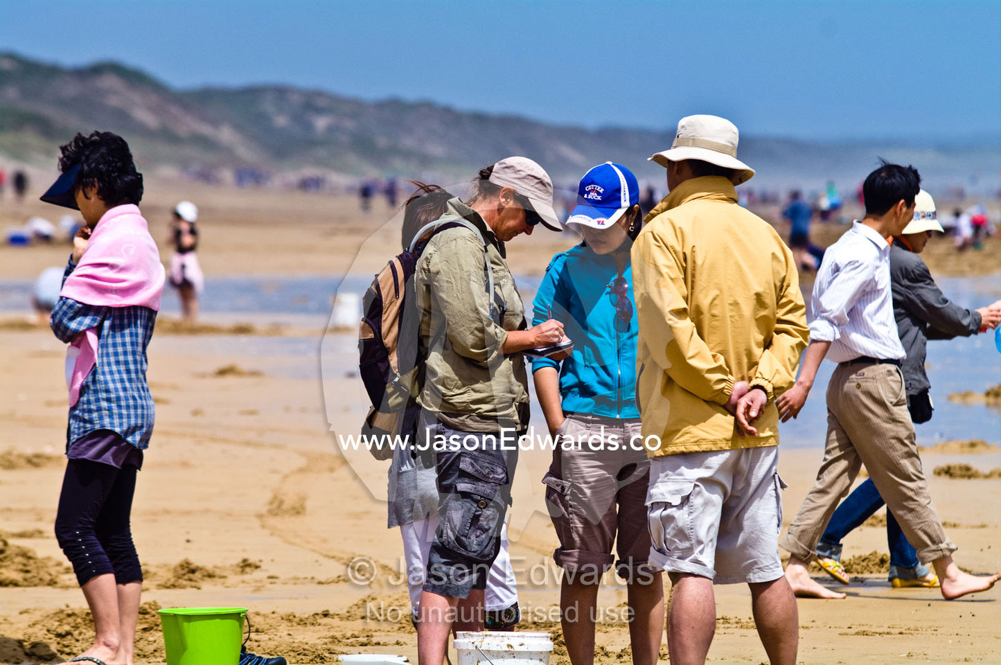 National Park Rangers issue fines to people exceeding the pipi quota. Venus Bay, Cape Liptrap Coastal Park, Bass Strait, South Gippsland, Victoria, Australia.