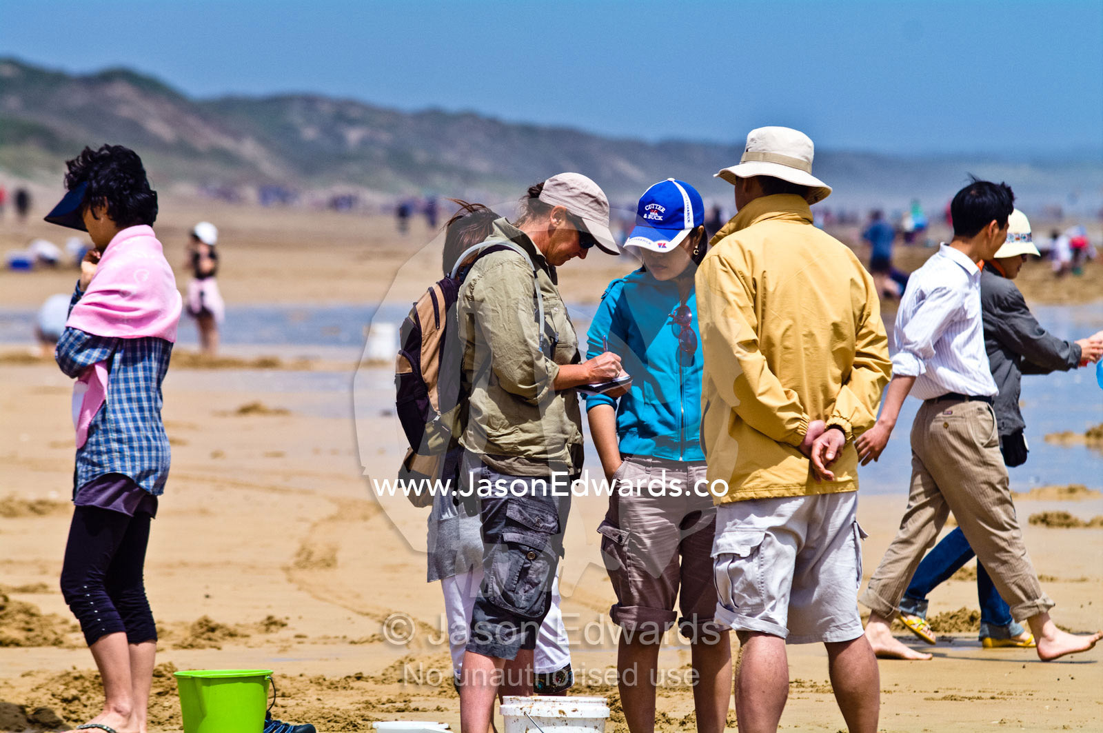 National Park Rangers issue fines to people exceeding the pipi quota. Venus Bay, Cape Liptrap Coastal Park, Bass Strait, South Gippsland, Victoria, Australia.