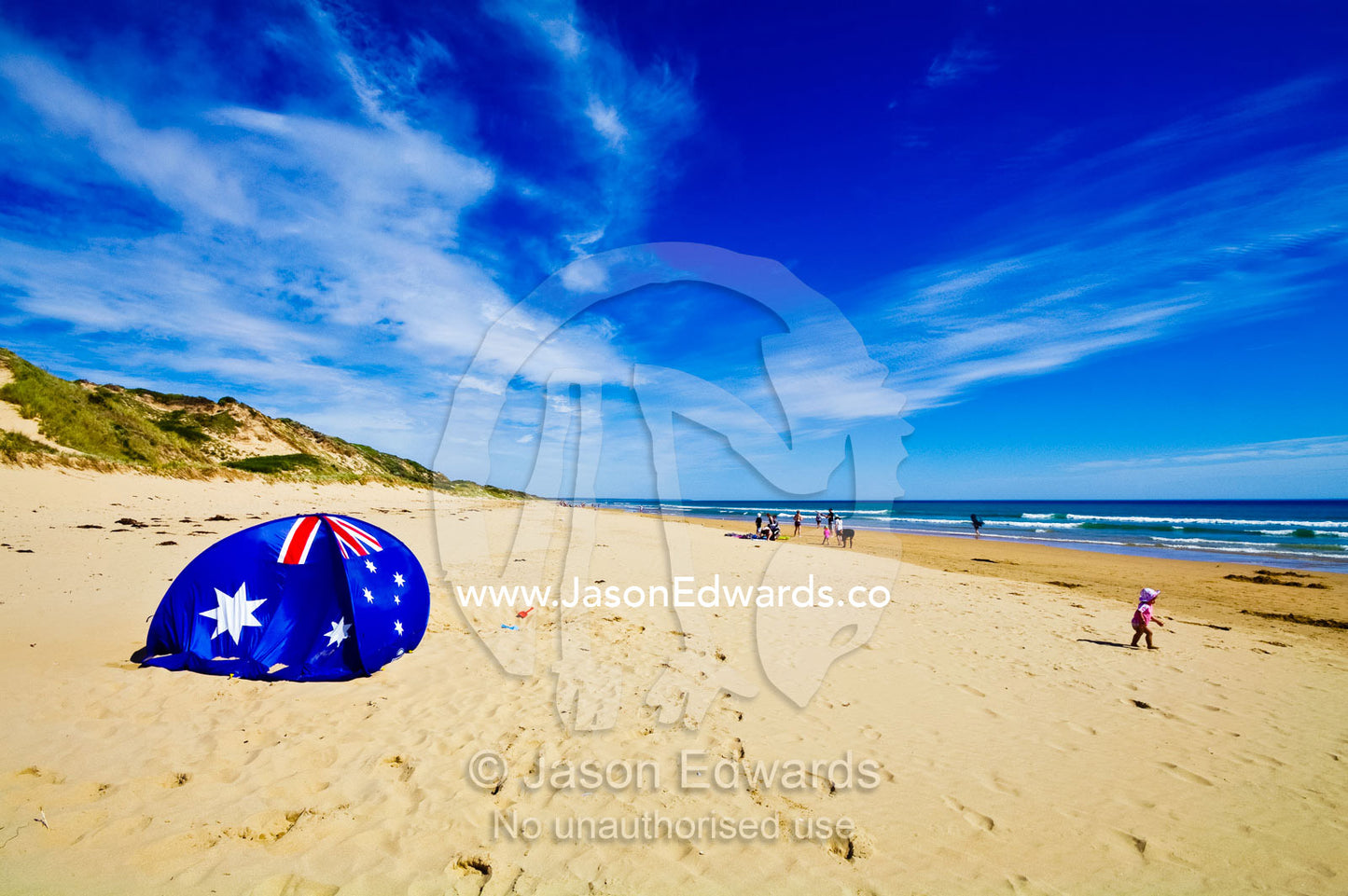 An Australian flag beach dome for shade on a sunny beach. Venus Bay, Cape Liptrap Coastal Park, Bass Strait, South Gippsland, Victoria, Australia.