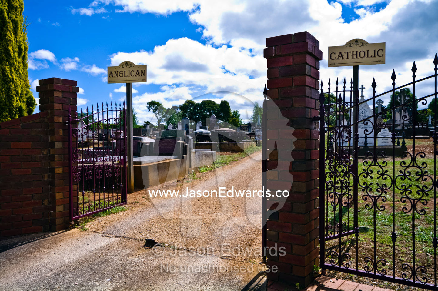 Cemetery gate signs for burial plots for Anglican and Catholic graves. Leongatha, South Gippsland, Victoria, Australia.