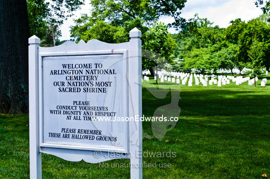 A cemetery sign welcomes visitors to a cemetery and requests respect. Arlington National Cemetery, Arlington, Virginia, United States of America.