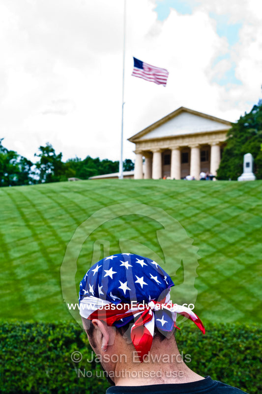 A patriot at the grave of President John F. Kennedy on Memorial Day. Arlington National Cemetery, Arlington, Virginia, United States of America.