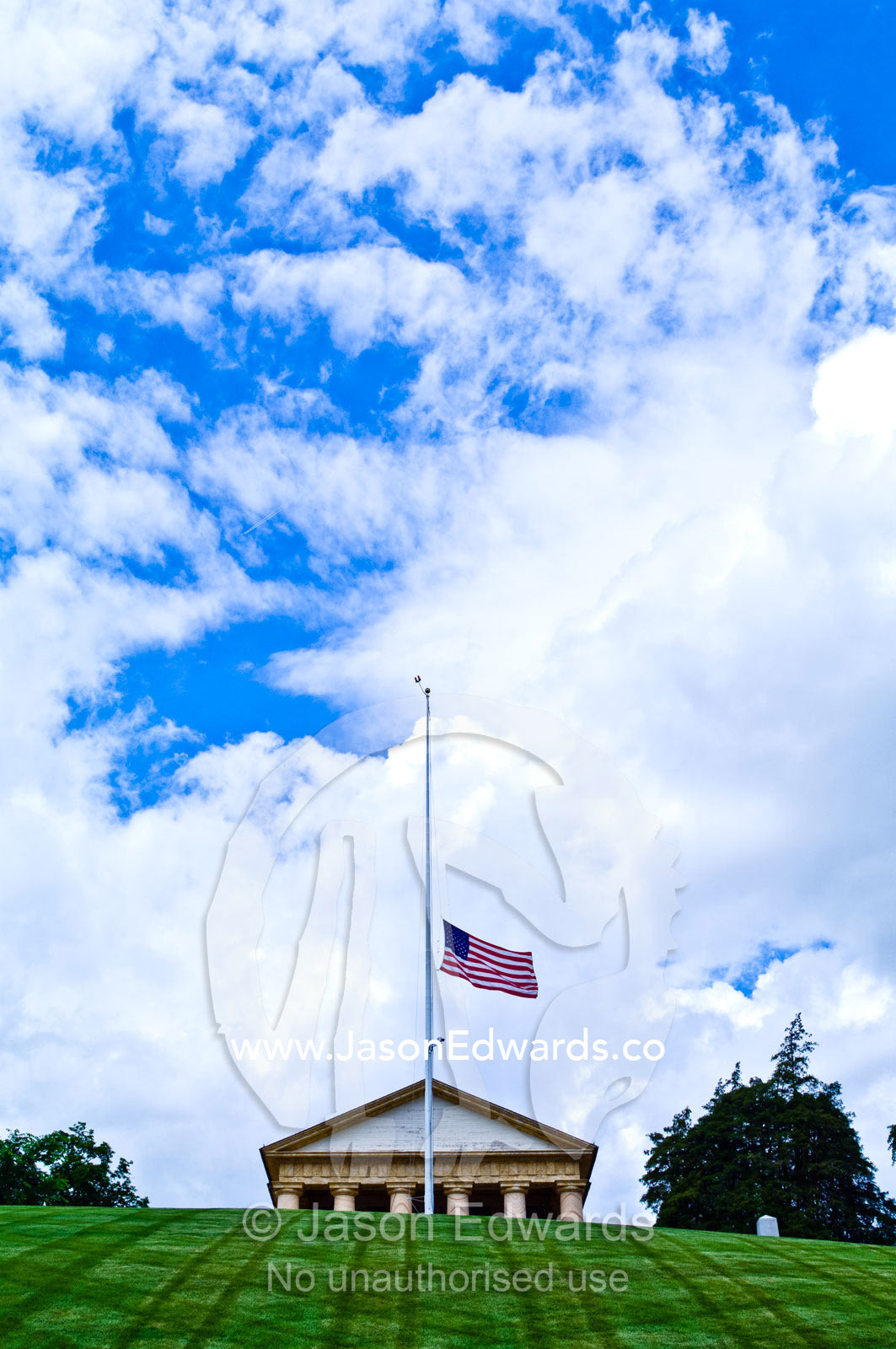 The American flag at half mast on Memorial Day at Arlington House. Arlington House, Custis-Lee Mansion, Arlington National Cemetery, Arlington, Virginia, United States of America.