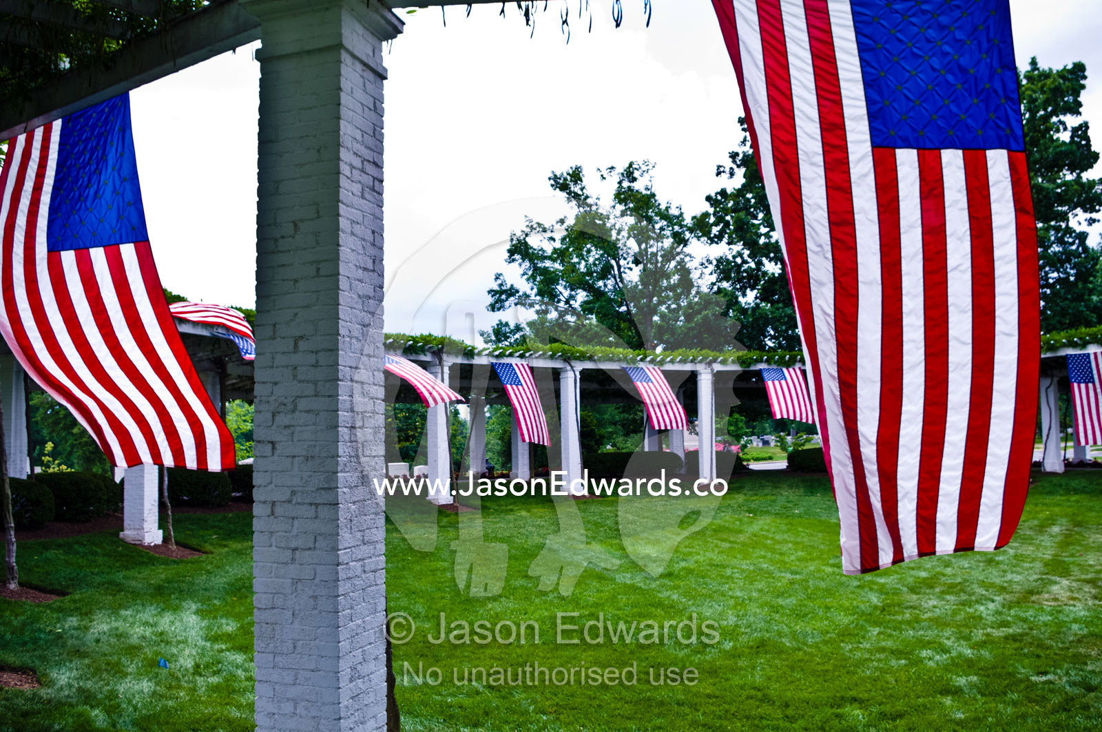 American flags surround the Old Amphitheater on Memorial Day. Old Amphitheater and Rostrum, Arlington National Cemetery, Arlington, Virginia, United States of America.
