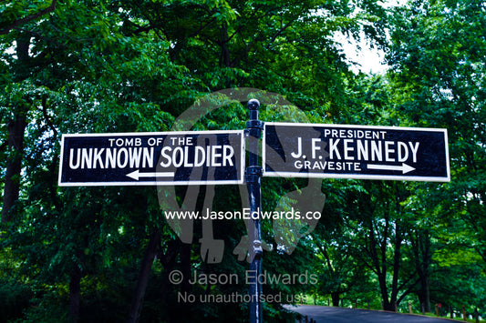 Signs direct visitors to specific graves and tombs at the cemetery. Arlington National Cemetery, Arlington, Virginia, United States of America.