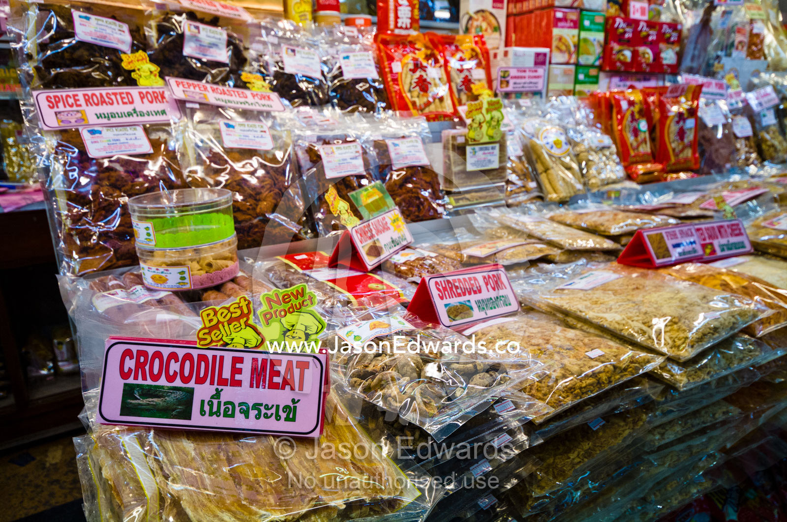 Crocodile meat and dried goods for sale in a shopping mall food court. MBK Centre, Mahboonkrong Shopping Center, Bangkok, Thailand.