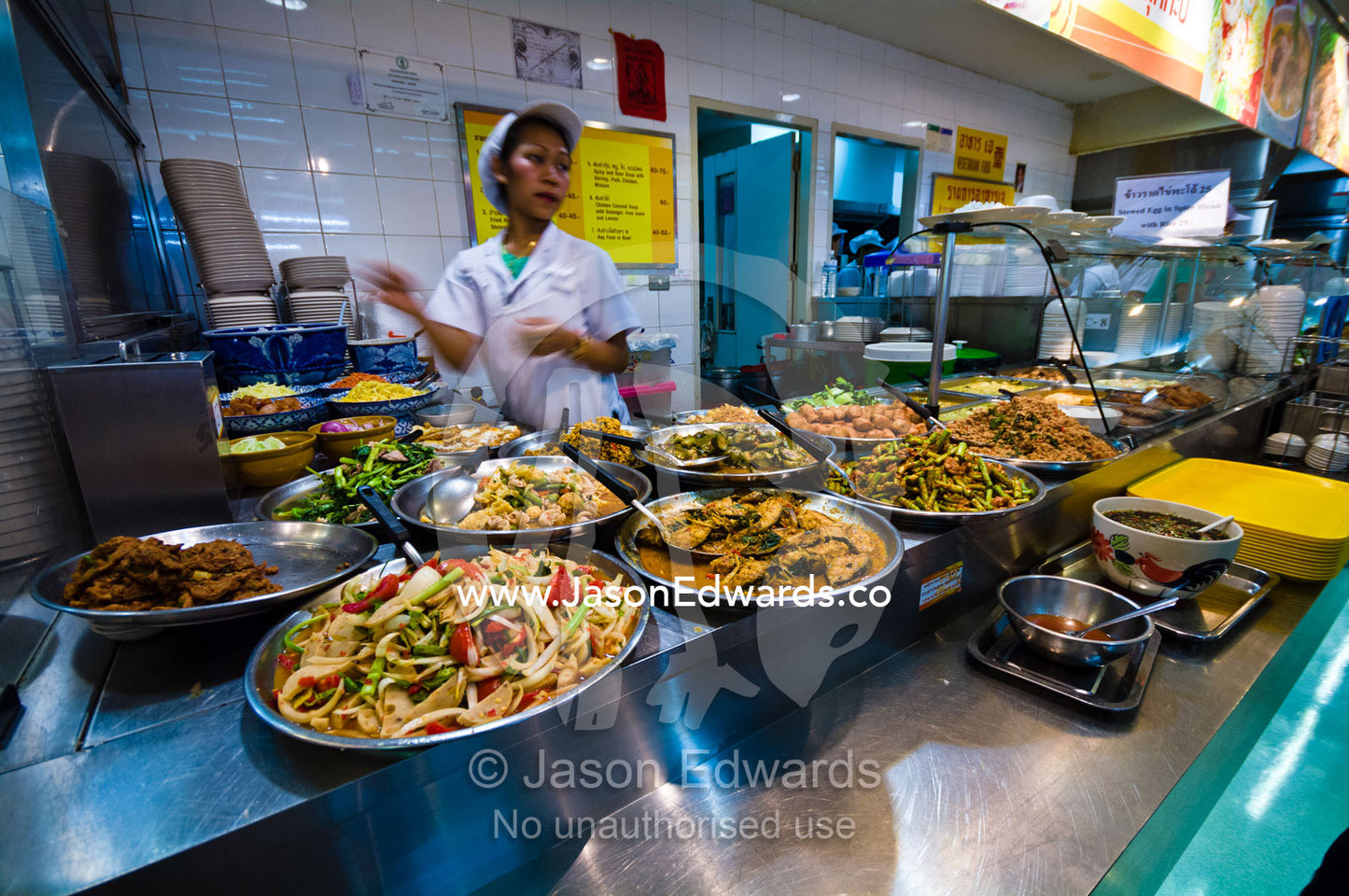 Take-away spicy noodle and curry dishes for sale in a mall food court. MBK Centre, Mahboonkrong Shopping Center, Bangkok, Thailand.