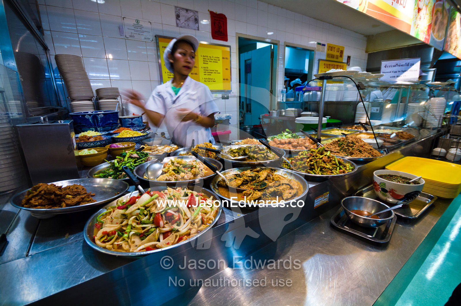 Take-away spicy noodle and curry dishes for sale in a mall food court. MBK Centre, Mahboonkrong Shopping Center, Bangkok, Thailand.