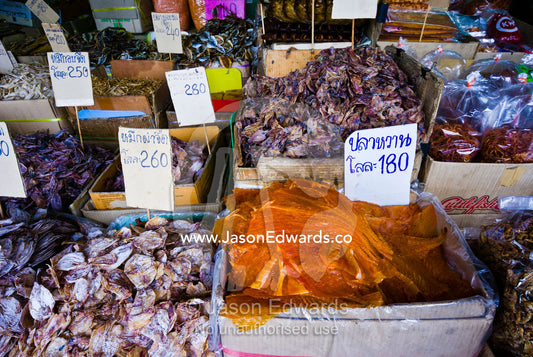 Piles of dried fish and seafood for sale in an open air market. Phra Nakhon District, Rattanakosin District, Bangkok, Thailand.