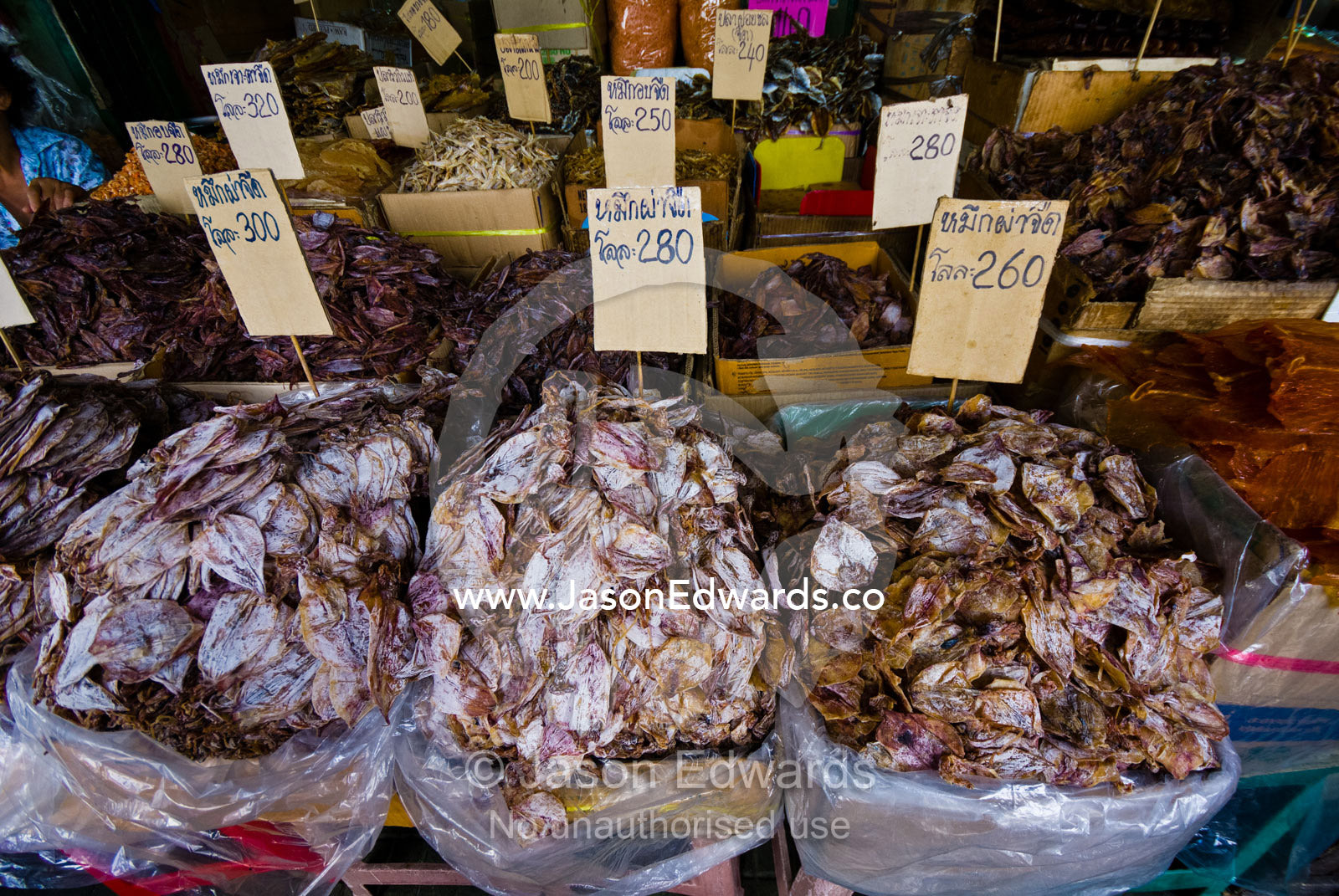 Piles of dried fish and seafood for sale in an open air market. Phra Nakhon District, Rattanakosin District, Bangkok, Thailand.