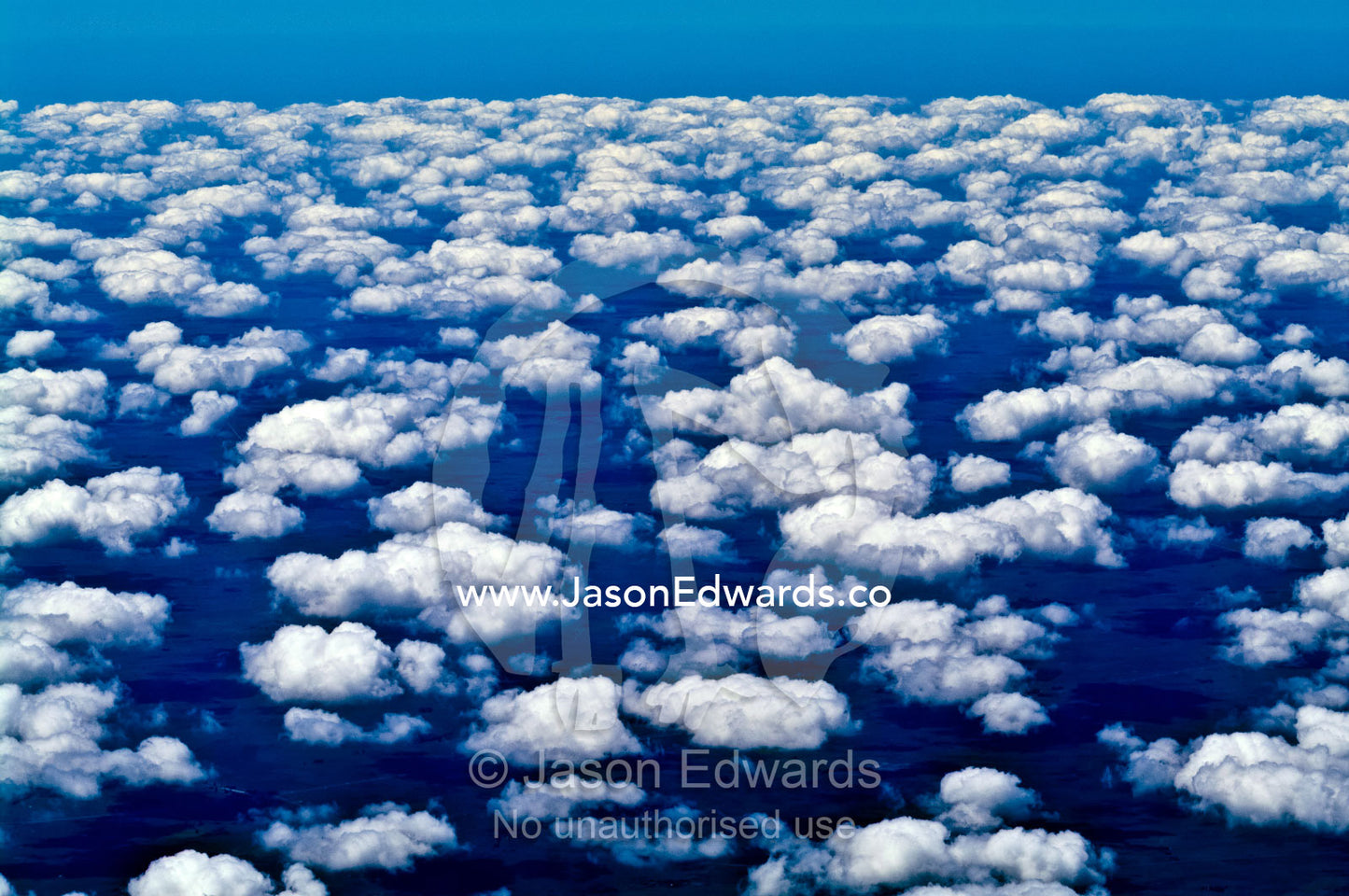 Flying high above a vast cotton-field cloud bank over farmland. south of Buenos Aires, Southern Argentina.