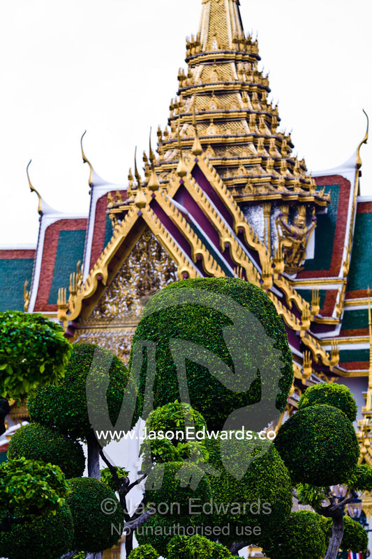Sculptured ornamental trees shaped into balls in the palace garden. Chakri Maha Prasad, The Grand Palace, The Lord's Supreme Palace, Royal Palace, Bangkok, Thailand.
