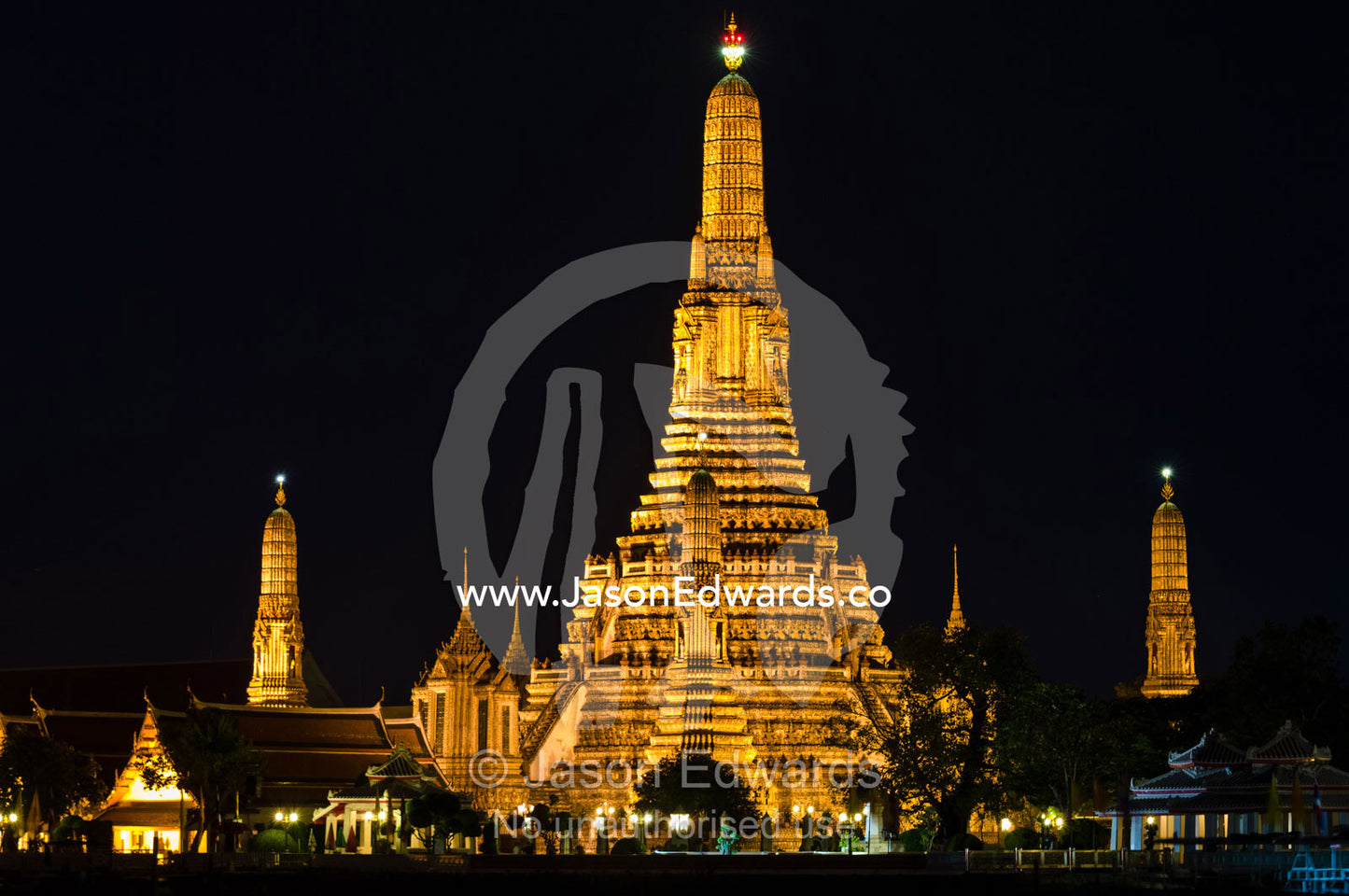 The Wat Arun temple with it's many prangs, Khmer-style towers. Wat Arun, Temple of the Dawn, Chao Phraya River, Bangkok Thailand.