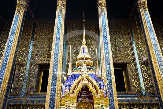 A shrine with golden prangs near the Temple of the Emerald Buddha. Wat Phra Kaew, Wat Phra Kaeo, Temple of the Emerald Buddha, Bangkok, Thailand.