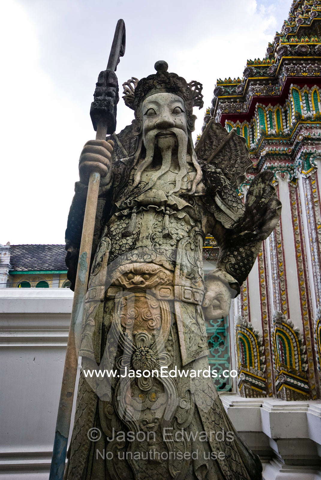 A guardian statue at the entrance to the Temple of the Emerald Buddha. Wat Phra Kaew, Wat Phra Kaeo, Temple of the Emerald Buddha, Bangkok, Thailand.
