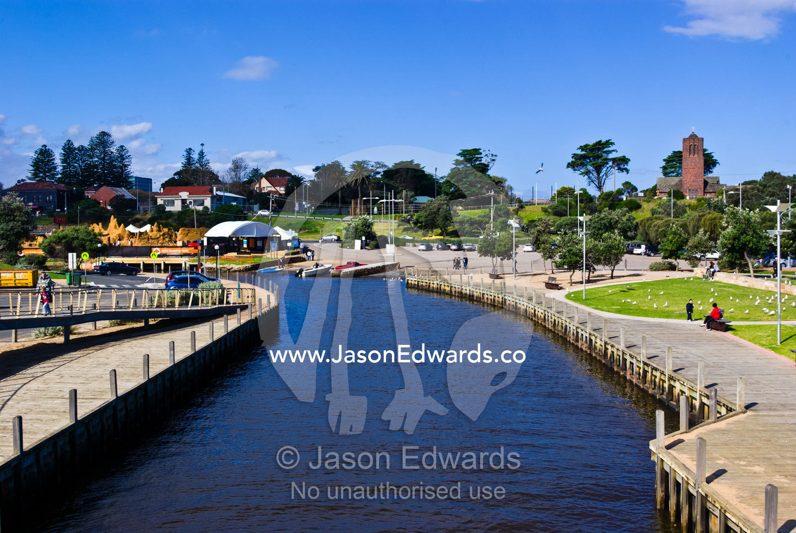 Boardwalks and walking trails through parkland beside a bayside creek. Kananook Creek, Frankston, Port Phillip Bay, Melbourne, Victoria, Australia.
