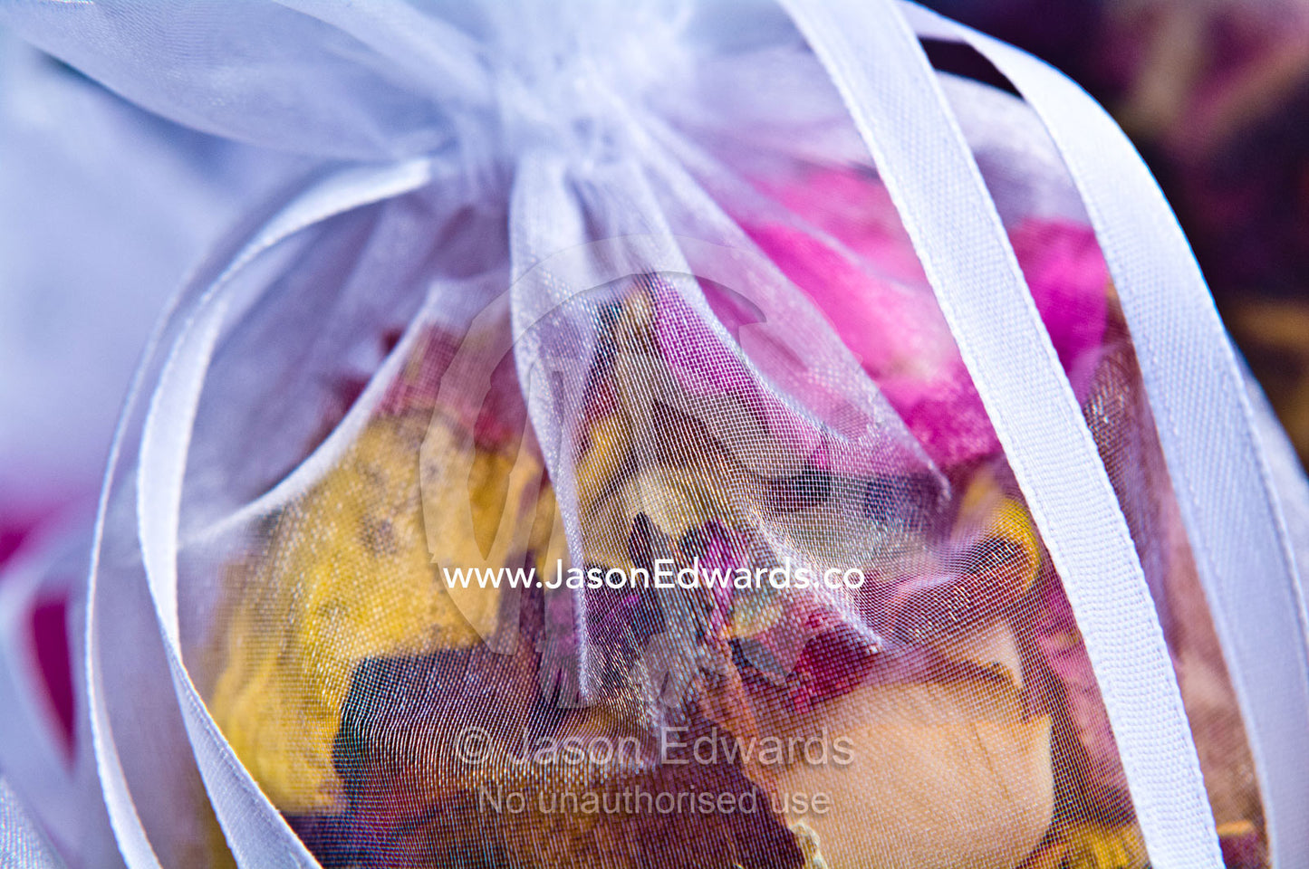 Dried rose petal potpourri used as bride confetti at a garden wedding. Park Orchards, Melbourne, Victoria, Australia.