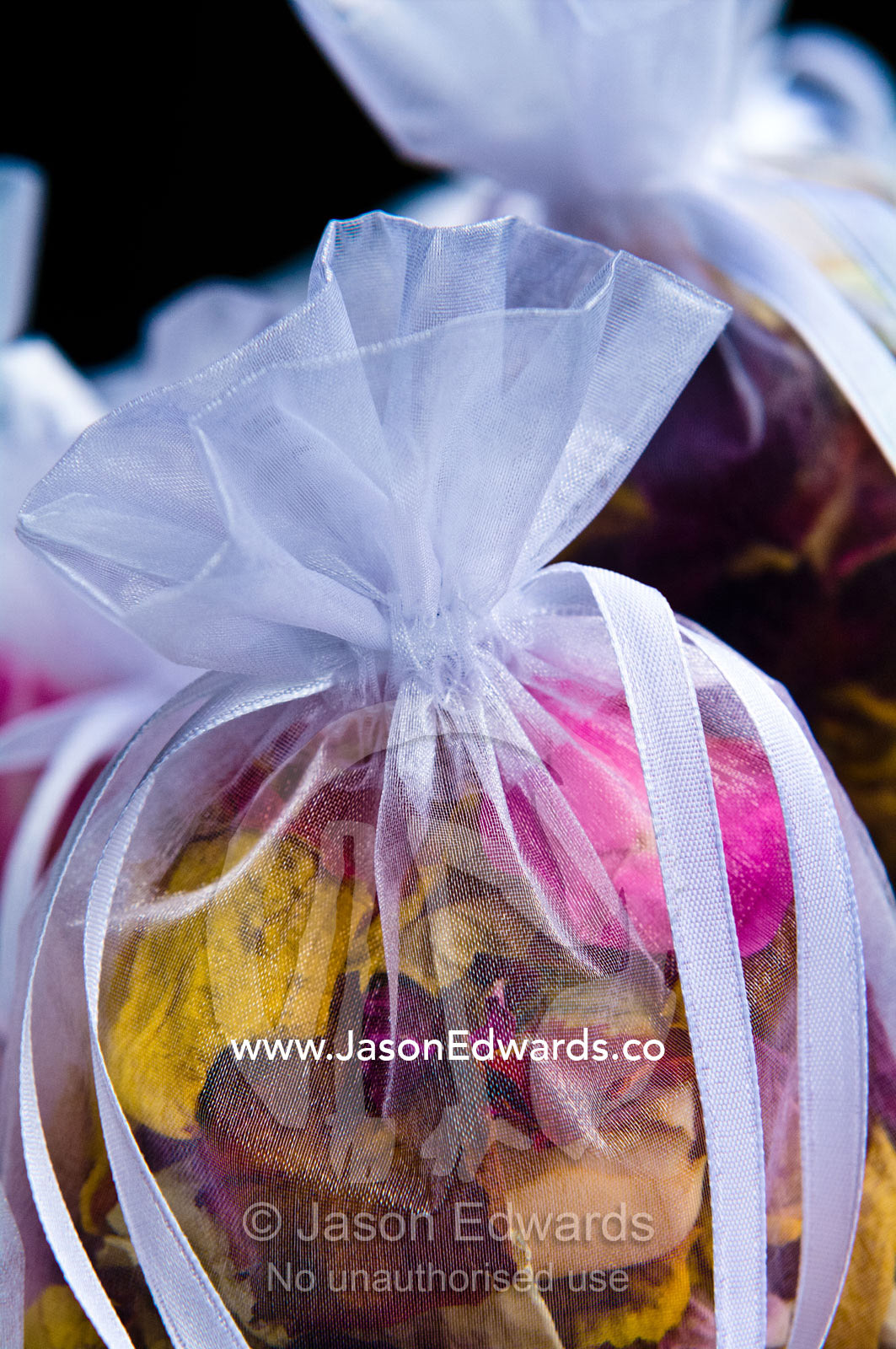 Dried rose petal potpourri used as bride confetti at a garden wedding. Park Orchards, Melbourne, Victoria, Australia.
