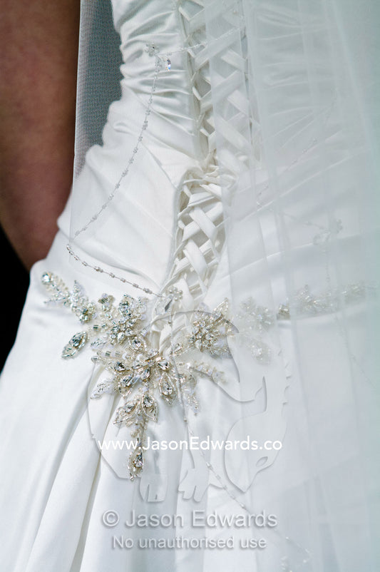 Diamant   appliqu   and corset laces on the back of a satin bridal gown. Park Orchards, Melbourne, Victoria, Australia.