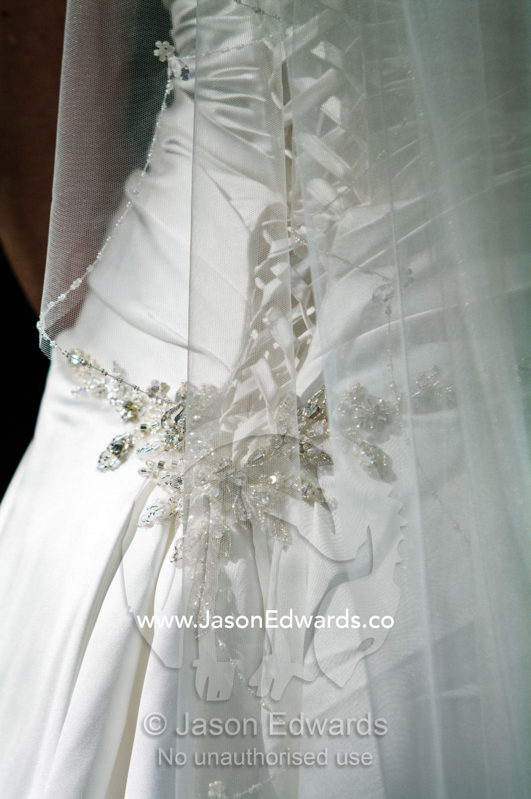 Diamante applique and corset laces on the back of a satin bridal gown. Park Orchards, Melbourne, Victoria, Australia.