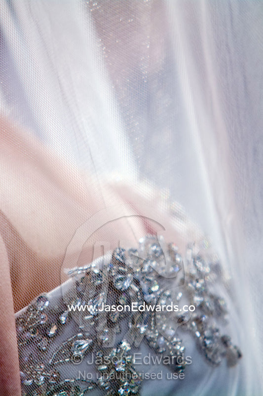 Tulle veil and rhinestone applique upon the bust of a bridal gown Park Orchards, Melbourne, Victoria, Australia.