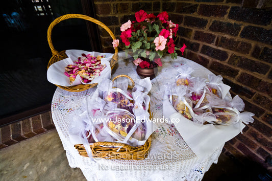 Dried rose petal potpourri used as bride confetti at a garden wedding. Park Orchards, Melbourne, Victoria, Australia.