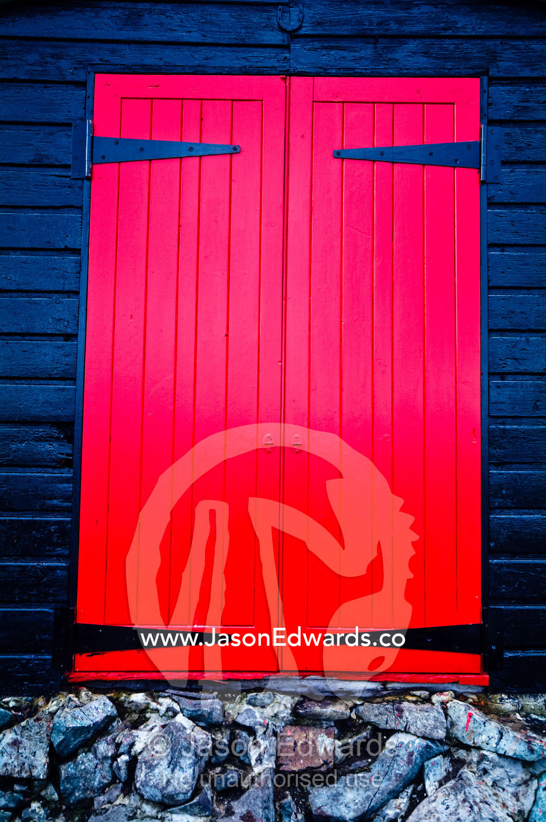 The bright red door of Wordie House, and Antarctic Historic Site. Winter Island, Argentine Islands, Faraday Islands, Antarctic Peninsula, Antarctica.
