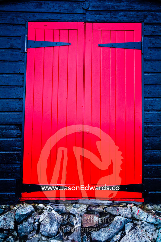 The bright red door of Wordie House, and Antarctic Historic Site. Winter Island, Argentine Islands, Faraday Islands, Antarctic Peninsula, Antarctica.