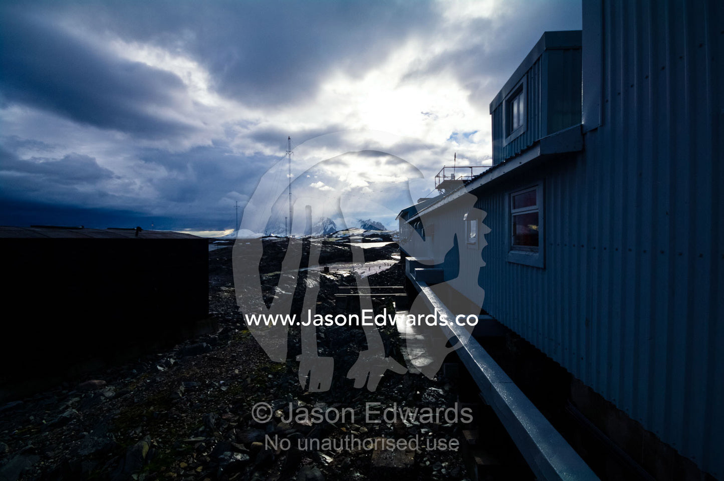 A menacing storm above an Antarctic research science laboratory. Vernadsky Antarctic Research Base, Galindez Island, Argentine Islands, Faraday Islands, Antarctic Peninsula, Antarctica.
