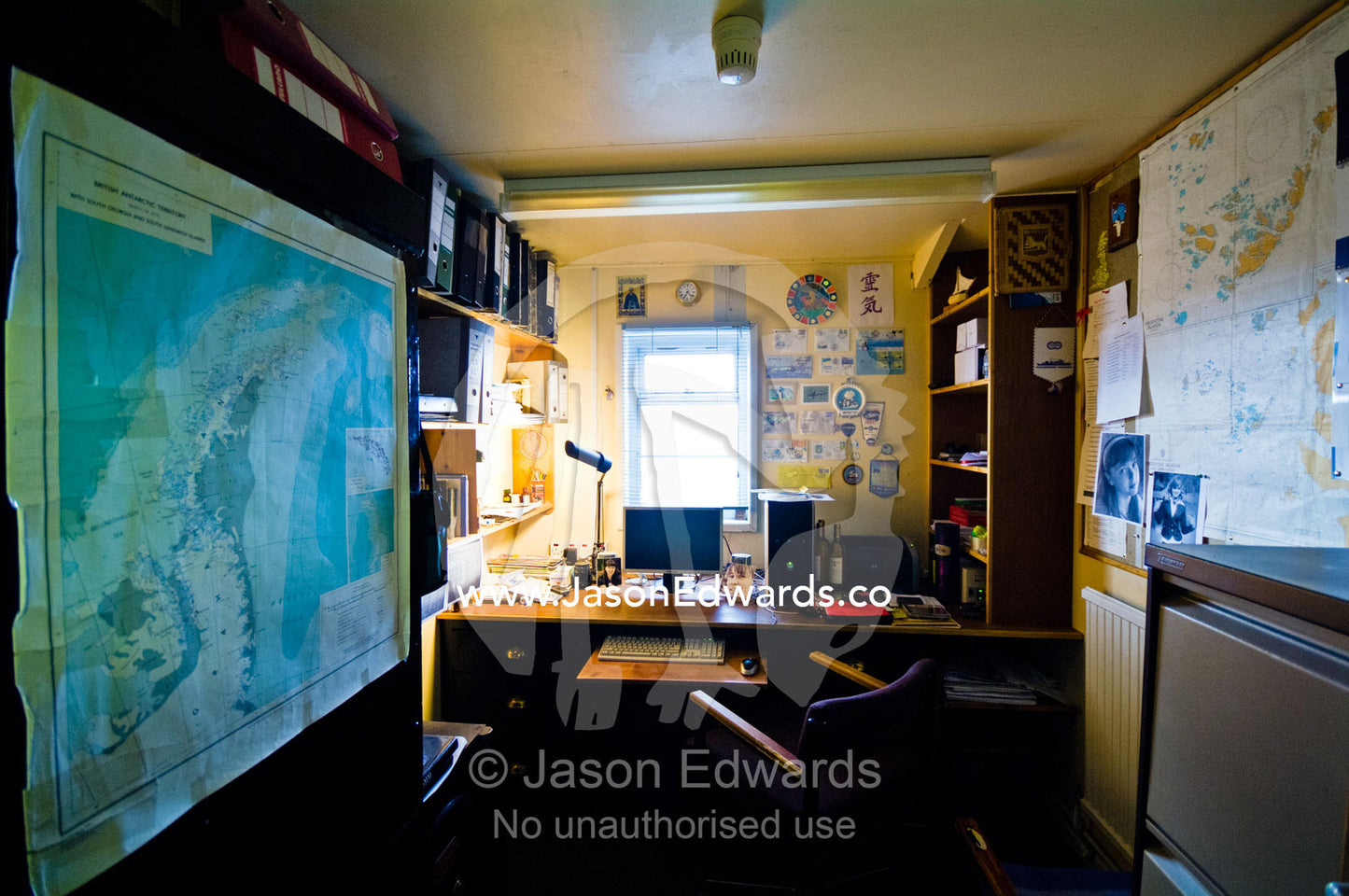 Maps line the wall of an office in a Ukrainian research station. Vernadsky Antarctic Research Base, Galindez Island, Argentine Islands, Faraday Islands, Antarctic Peninsula, Antarctica.
