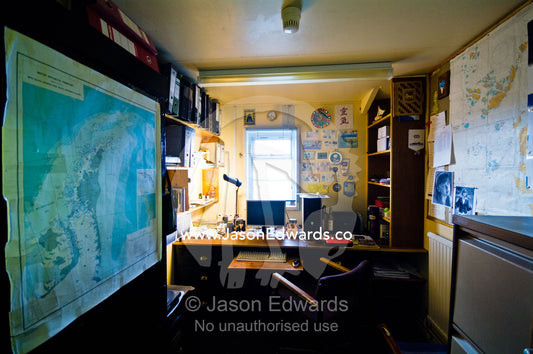 Maps line the wall of an office in a Ukrainian research station. Vernadsky Antarctic Research Base, Galindez Island, Argentine Islands, Faraday Islands, Antarctic Peninsula, Antarctica.