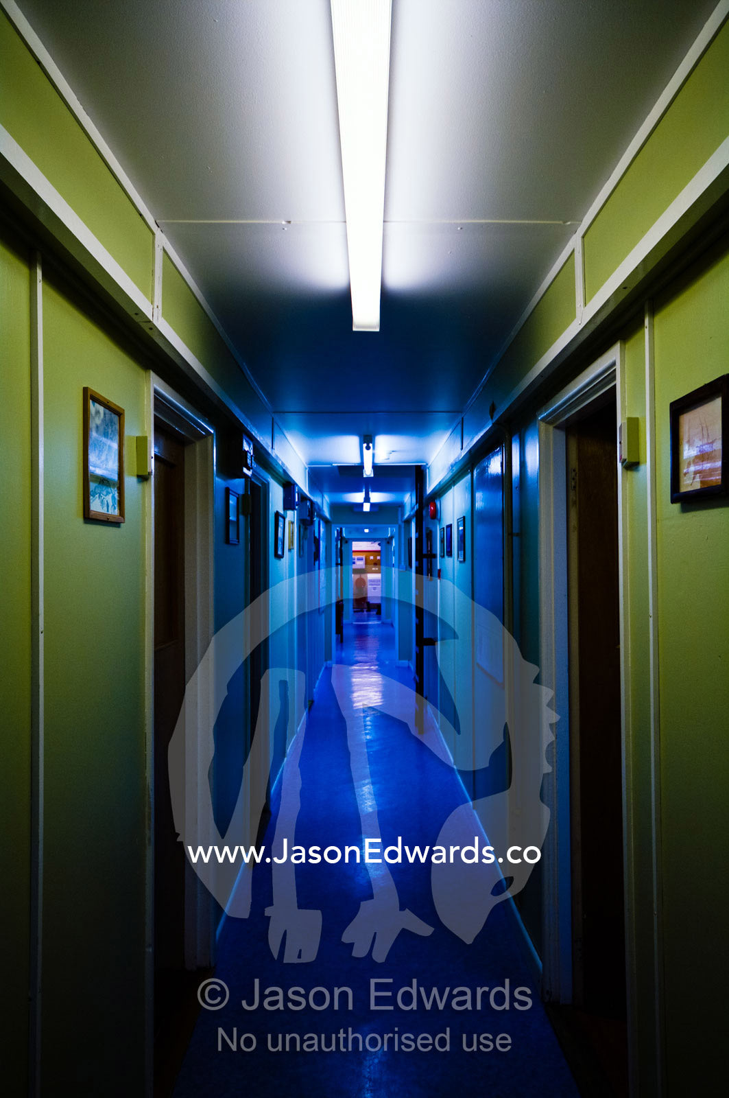 Eerie blue fluorescent lighting in a corridor of a research station. Vernadsky Antarctic Research Base, Galindez Island, Argentine Islands, Faraday Islands, Antarctic Peninsula, Antarctica.
