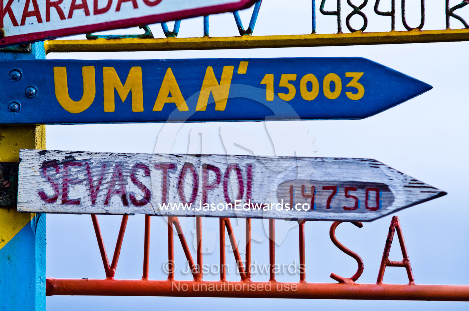 A directional sign at a Ukrainian station points to distant cities. Vernadsky Antarctic Research Base, Galindez Island, Argentine Islands, Faraday Islands, Antarctic Peninsula, Antarctica.