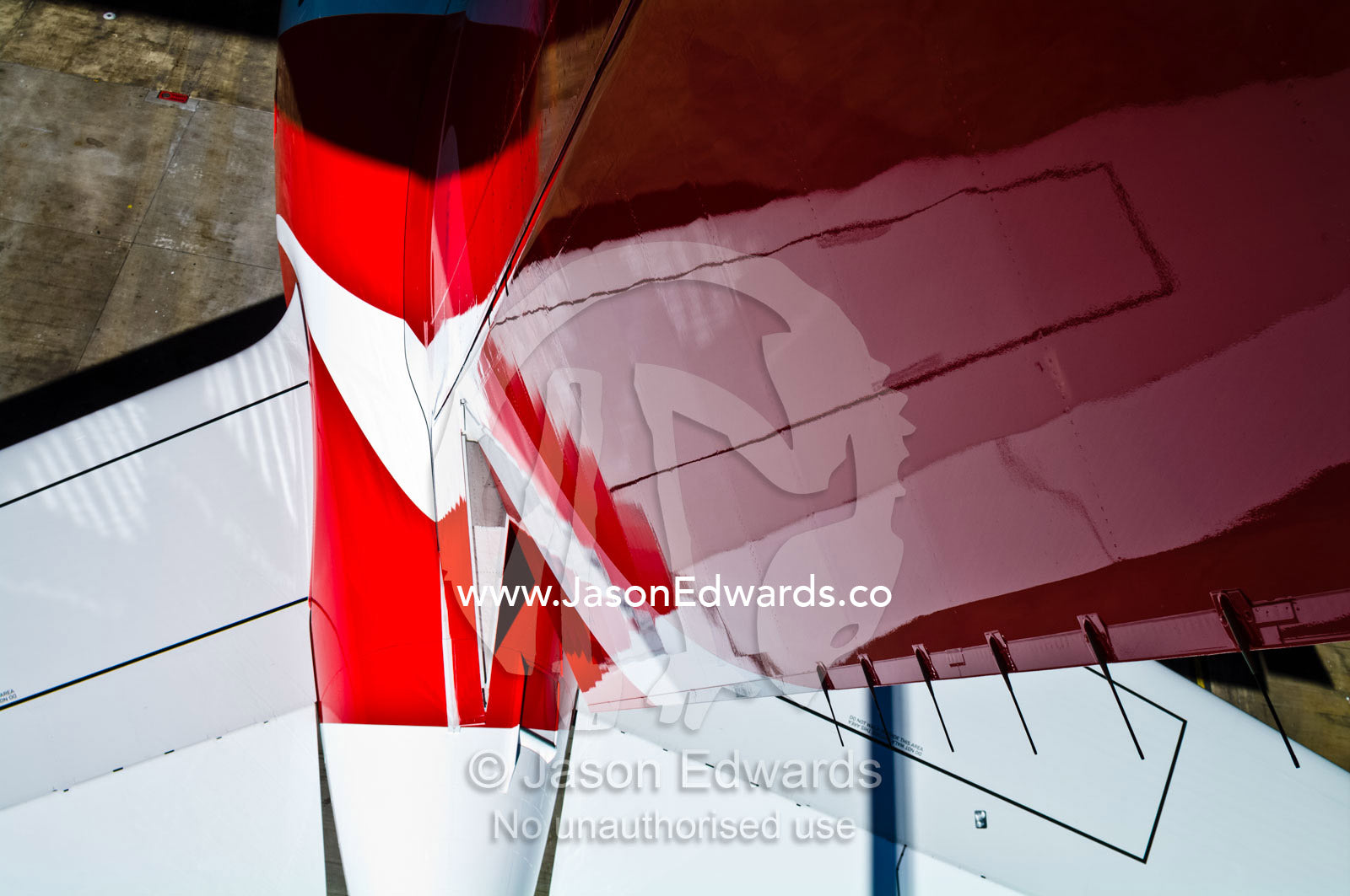 The vertical stabiliser and rudder of a jet airliner in a hangar. Kingsford Smith Airport, Mascot, Sydney, New South Wales, Australia.