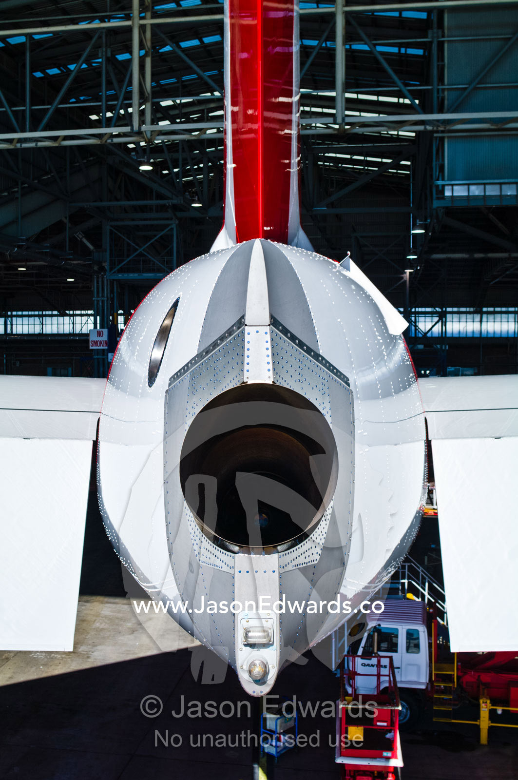 The empennage and auxiliary power unit exhaust of an A380. Kingsford Smith Airport, Mascot, Sydney, New South Wales, Australia.