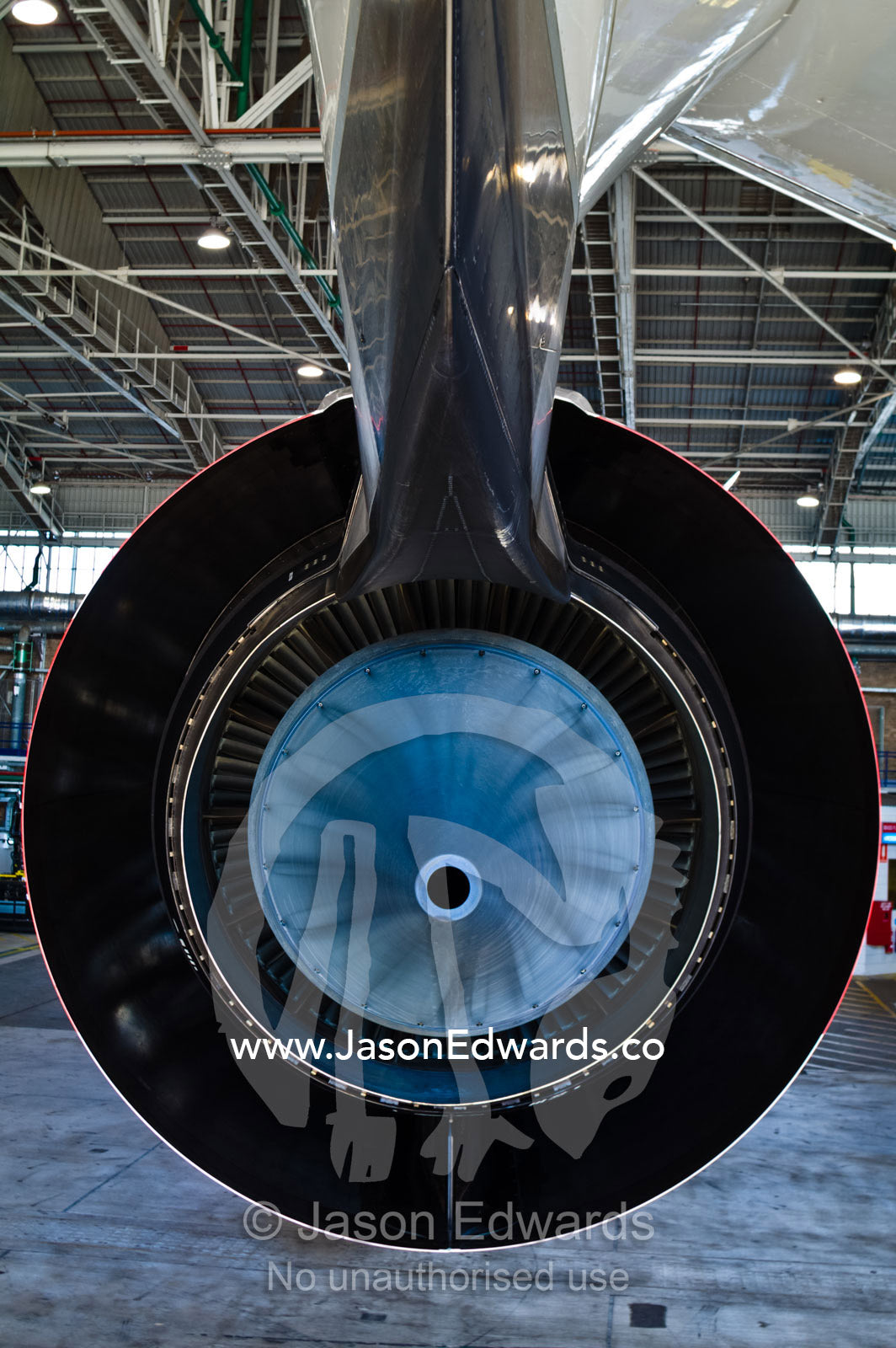 The blue titanium exhaust plug of a Rolls Royce A380 Jet engine. Kingsford Smith Airport, Mascot, Sydney, New South Wales, Australia.