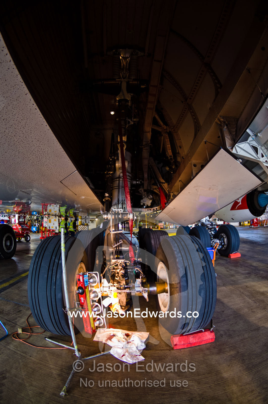 Maintenance repairs on the landing gear and wheels of a jet airliner. Kingsford Smith Airport, Mascot, Sydney, New South Wales, Australia.