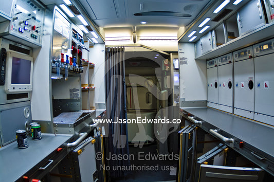 A modern galley kitchen in a jet airliner with storage compartments. Kingsford Smith Airport, Mascot, Sydney, New South Wales, Australia.