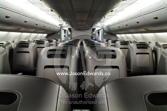 Rows of empty graphite business class passenger seats in a plane cabin. Kingsford Smith Airport, Mascot, Sydney, New South Wales, Australia.
