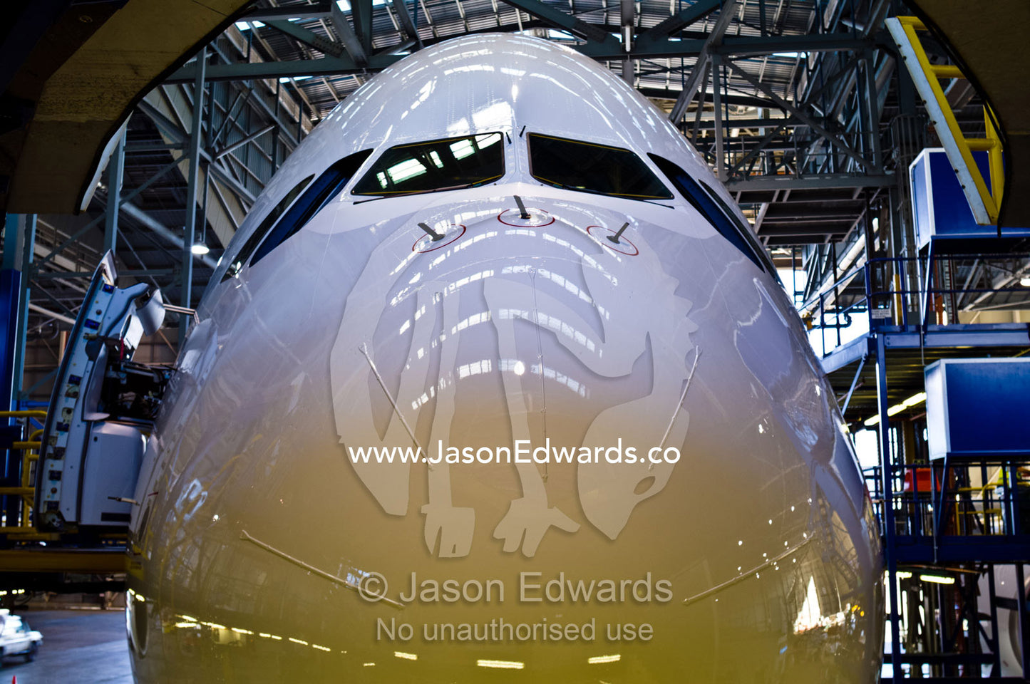 A jet airline cockpit and nose cone in a hangar for maintenance. Kingsford Smith Airport, Mascot, Sydney, New South Wales, Australia.