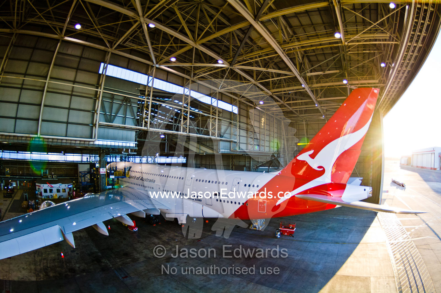 Jet airliner garaged in an airport hangar for repairs and maintenance. Kingsford Smith Airport, Mascot, Sydney, New South Wales, Australia.