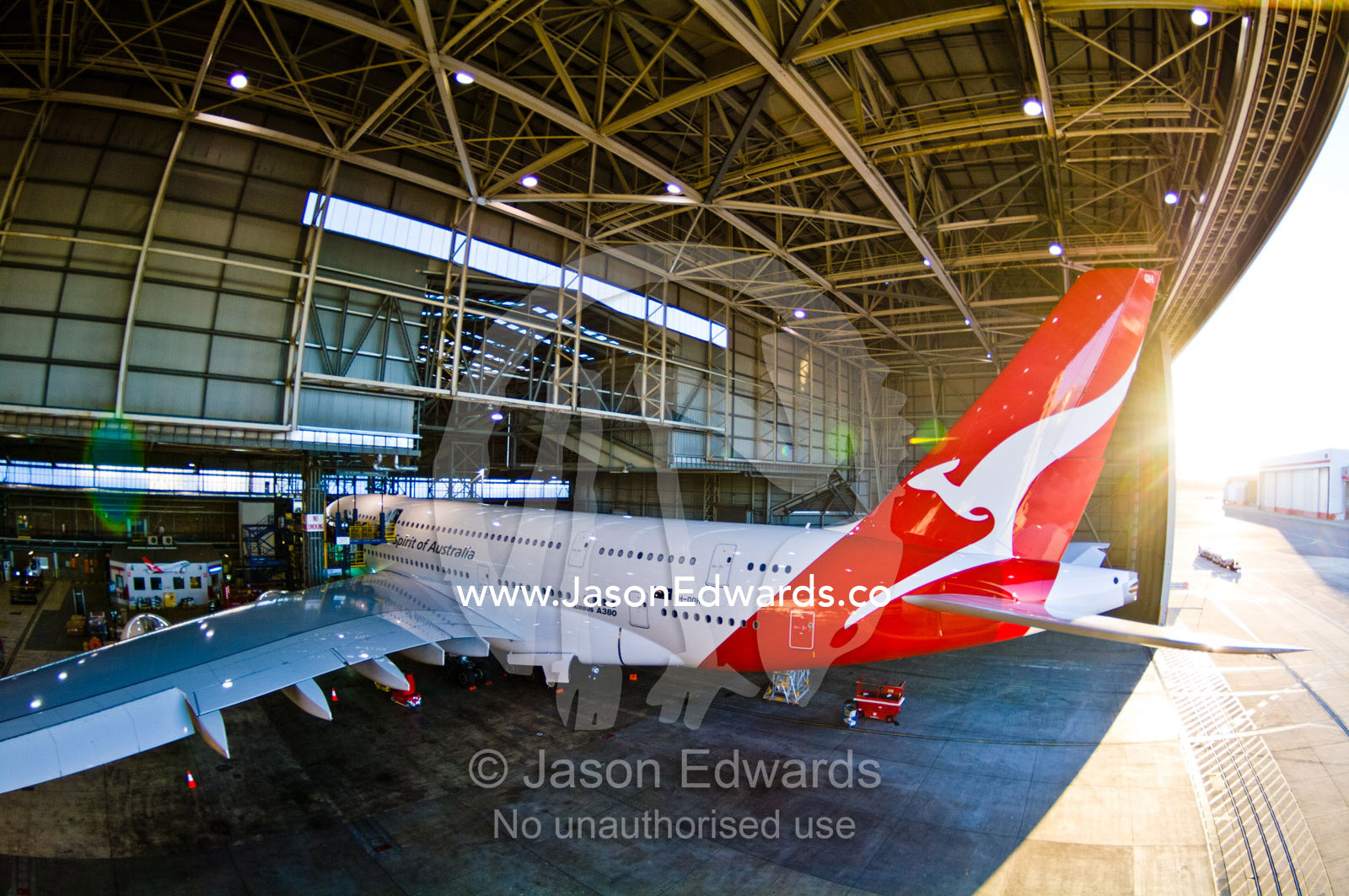 Jet airliner garaged in an airport hangar for repairs and maintenance. Kingsford Smith Airport, Mascot, Sydney, New South Wales, Australia.