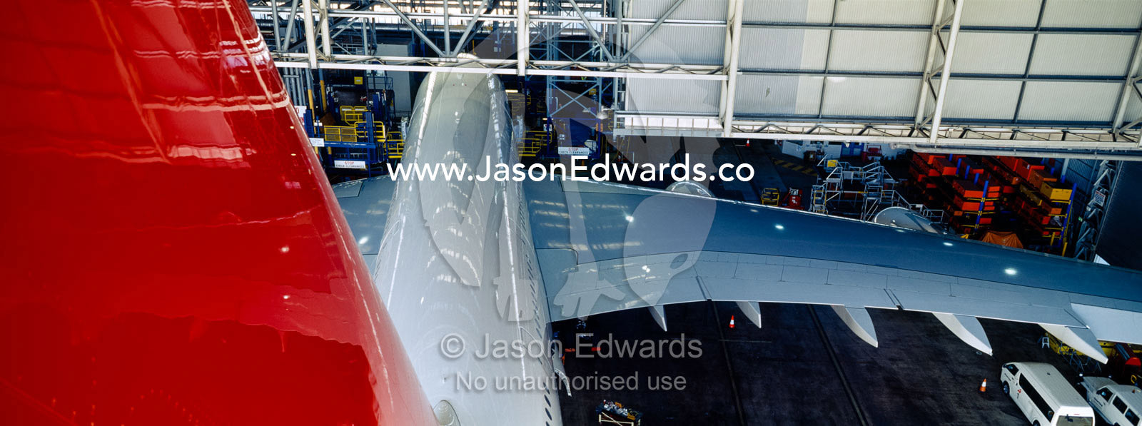 Jet airliner garaged in an airport hangar for repairs and maintenance. Kingsford Smith Airport, Mascot, Sydney, New South Wales, Australia.