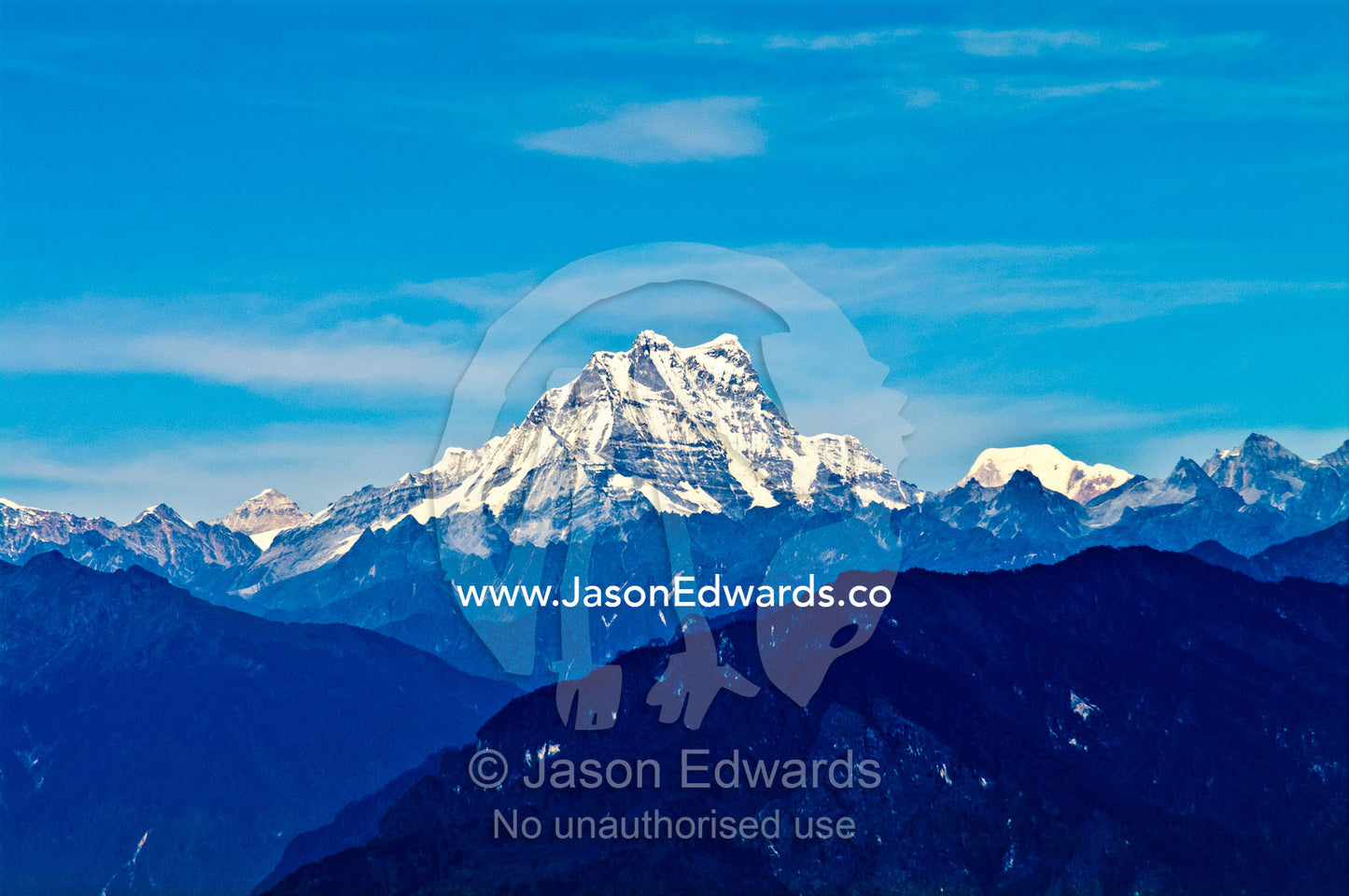 The rugged snow and ice cover spine of Mount Masagang in the Himalayan mountain range. Dochula Pass, Thimphu District, Bhutan.