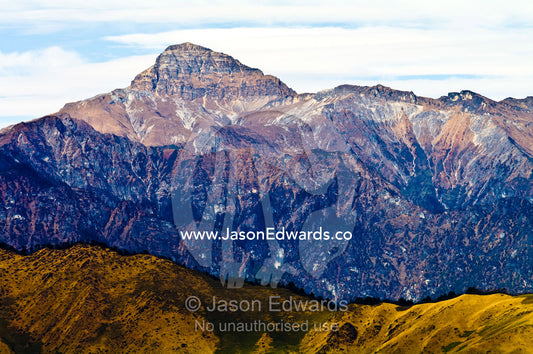 A sheer and rugged Himalaya mountain peak free from snow and ice due to global warming. Punakha District, Bhutan.